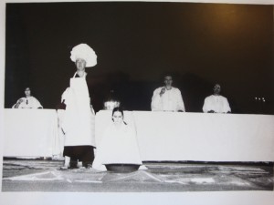 The final banquet scene performed as a grotesque Punch and Judy show. Actors tread the stage in disarticulated, mechanical movements